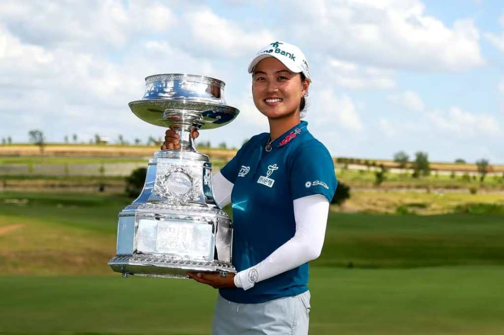 Minjee Lee holding the KPMG Women's PGA Championship trophy after winning the 2025 tournament at Fields Ranch East.