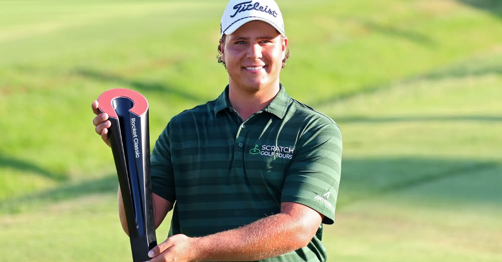 Aldrich Potgieter holding the Rocket Classic trophy after winning his first PGA Tour event.