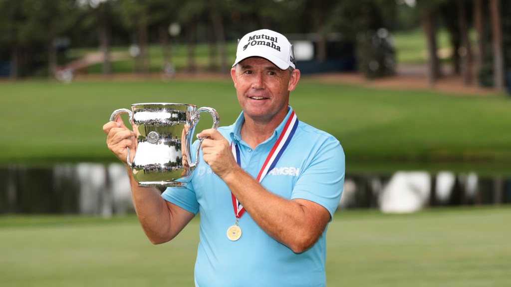 Padraig Harrington holds the U.S. Senior Open trophy after winning the 2025 championship at The Broadmoor