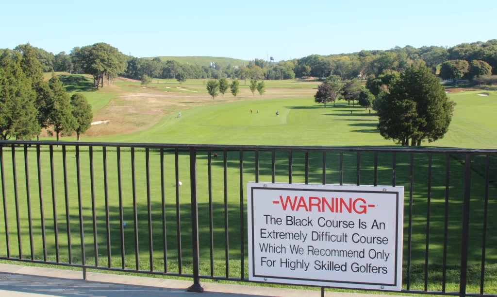 Warning sign at Bethpage Black golf course advising that the course is extremely difficult and recommended only for highly skilled golfers